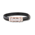 Black and rose gold bracelet with diamond-like accents on a white background