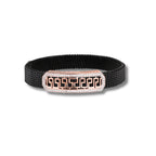 Black mesh bracelet with a rose gold and silver clasp on a white background
