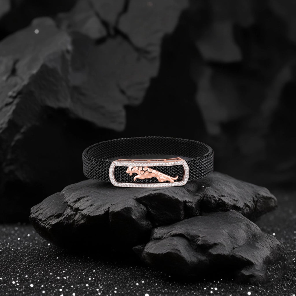 Black bracelet with a rose gold clasp featuring a panther design on a dark background.
