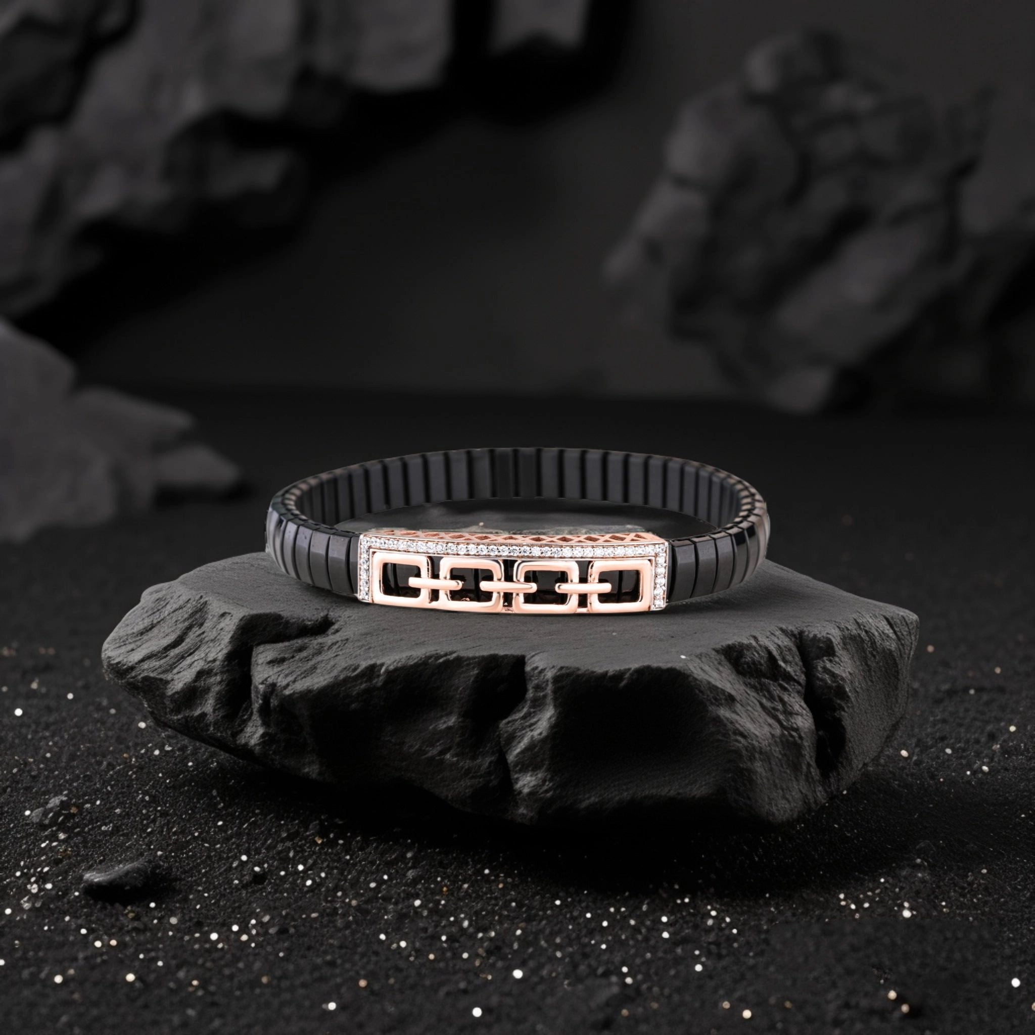 Black bracelet with a geometric design on a dark stone surface