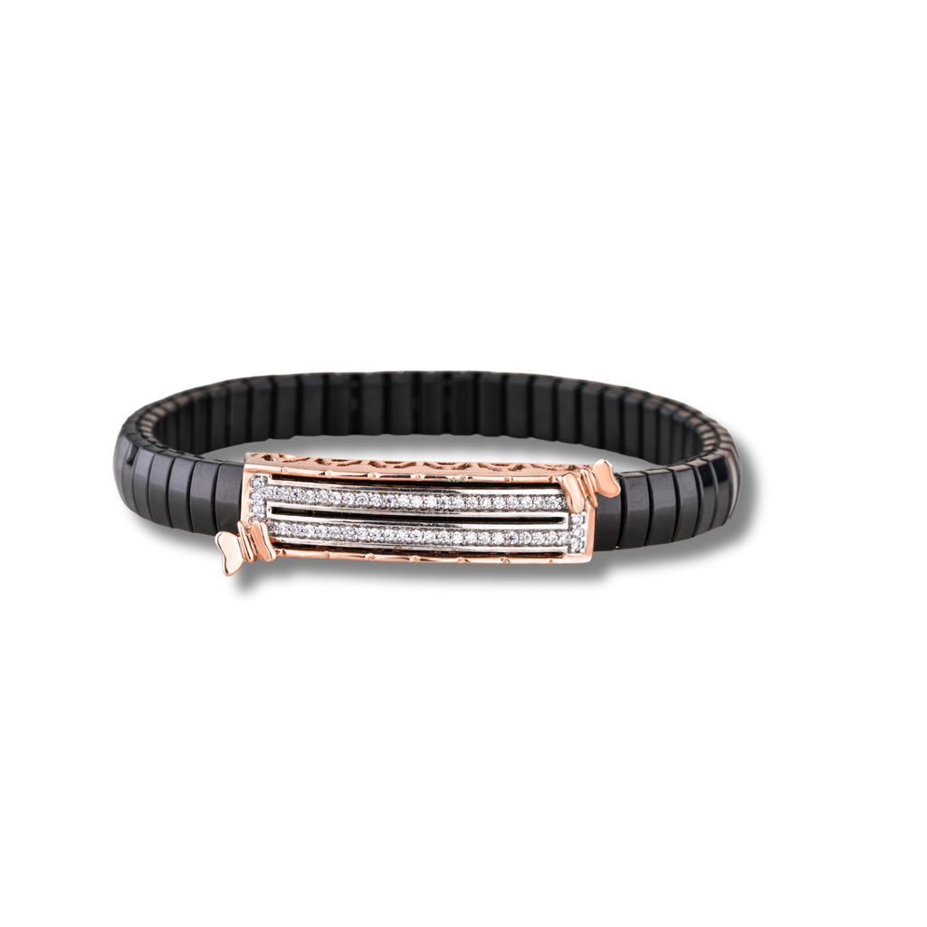 Black bracelet with rose gold clasp on a white background