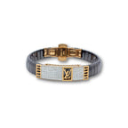 Luxury bracelet with gold and black design on a white background