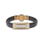 Bracelet with black ceramic and rose gold metal design on a white background