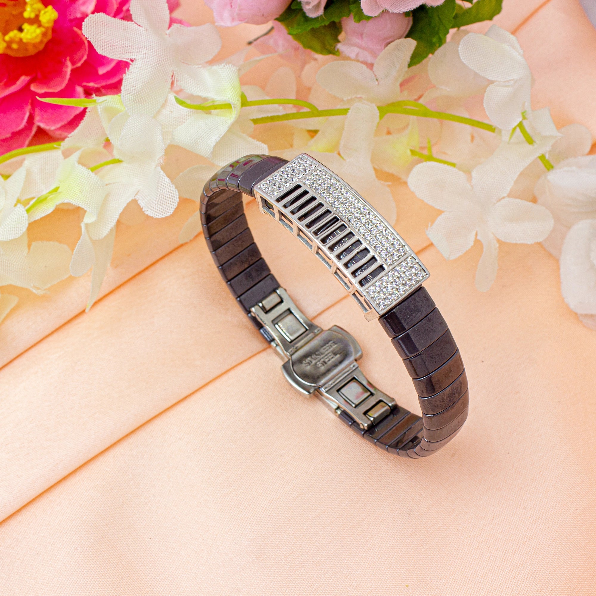 Bracelet with decorative clasp on a floral background