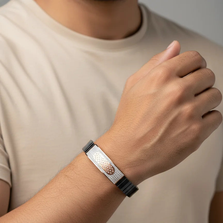 Person wearing a smartwatch on a plain background