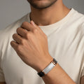 Silver texture men’s imitation bracelet with rose gold accent worn on wrist